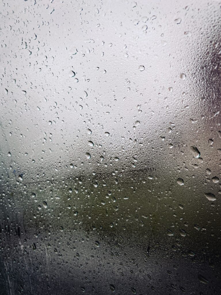 Macro Water Droplets on Glass Surface - Blurred Wallpaper Background