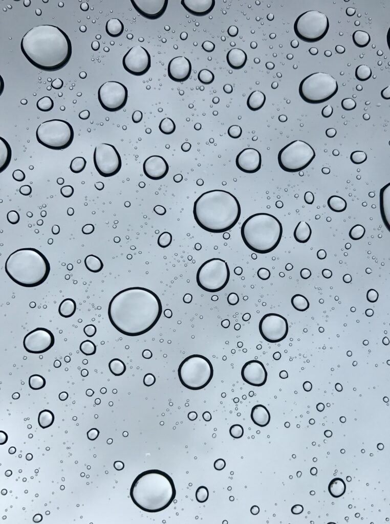 Macro Water Droplets on Glass: Elegant Gray Wallpaper Background