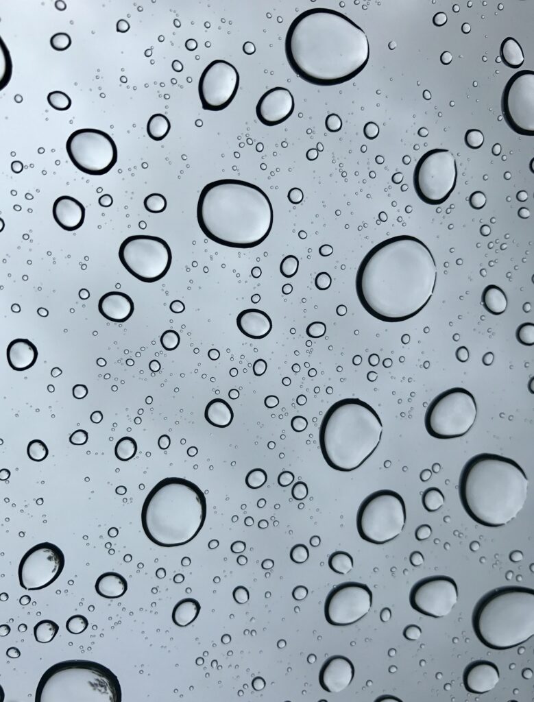 Macro Water Droplets on Smooth Gray Surface - Stunning Wallpaper
