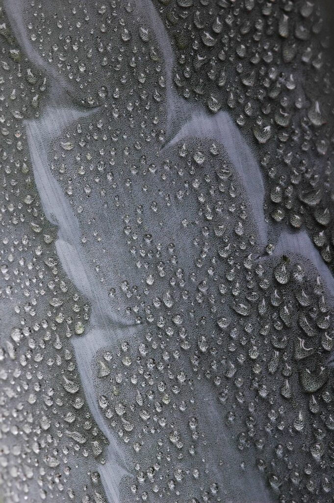 Close-Up Macro Water Drops on Grey Surface - Rain Effect Wallpaper