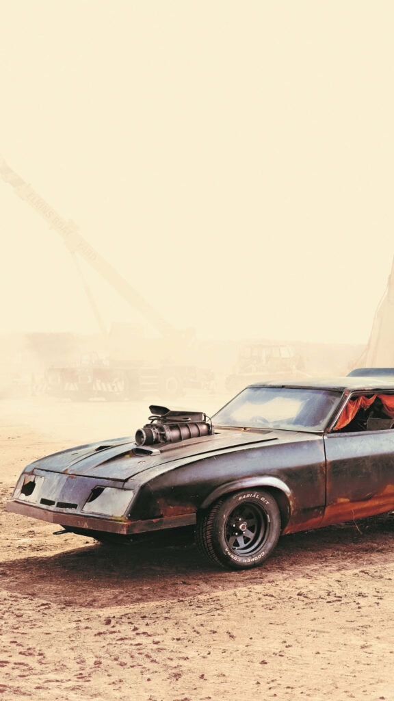 Mad Max Fury Road rugged vehicle in dusty desert post-apocalyptic landscape wallpaper background