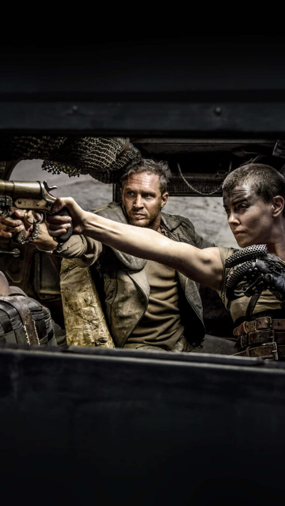 Mad Max intense battle scene with fierce characters in rugged post-apocalyptic vehicle wallpaper
