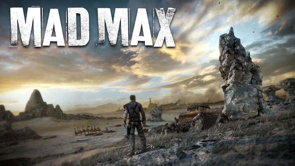 Mad Max wallpaper with lone figure in desolate wasteland rugged rocks and old vehicle ruins