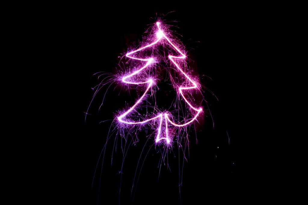 Magical Sparkling Christmas Tree Design on Black Background Wallpaper
