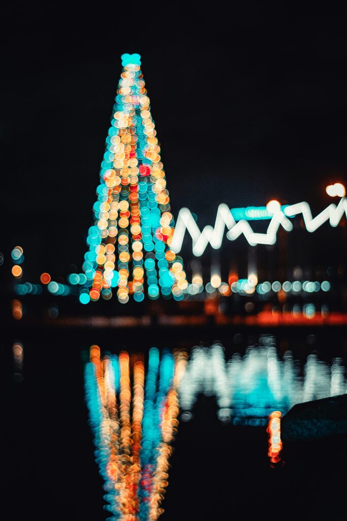 Festive Christmas Tree Wallpaper: Colorful Bokeh & Magical Lighting