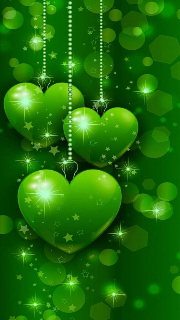 Glowing Green Hearts Wallpaper with Starry Bokeh Background