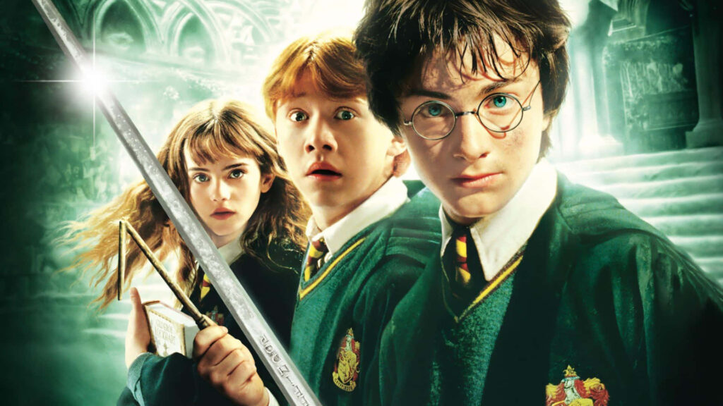 Harry Ron Hermione with Sword of Gryffindor and Lockhart book Hogwarts green background wallpaper