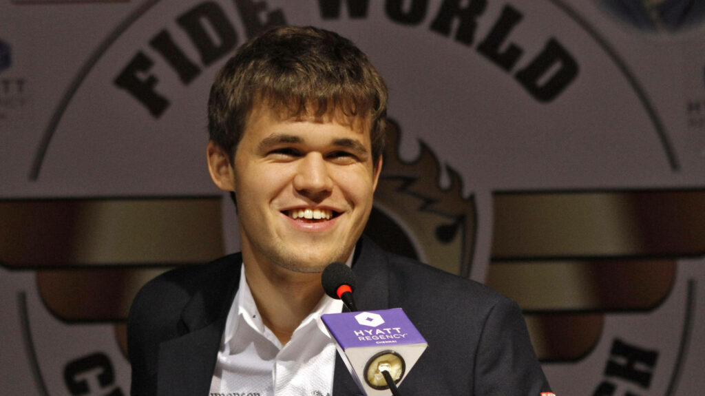 Magnus Carlsen Smiling - Chess Grandmaster Wallpaper Background