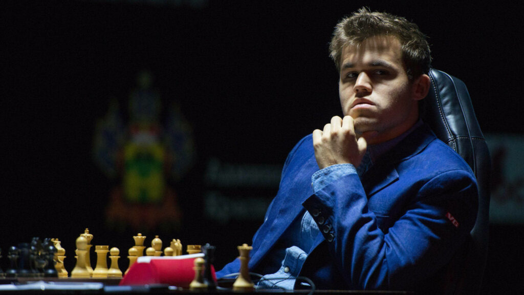 Magnus Carlsen: Focused Chess Master Wallpaper Background