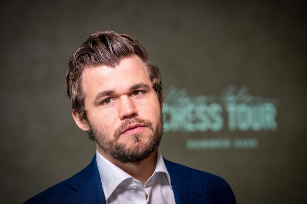Magnus Carlsen Wallpaper: Confident & Captivating Background Design