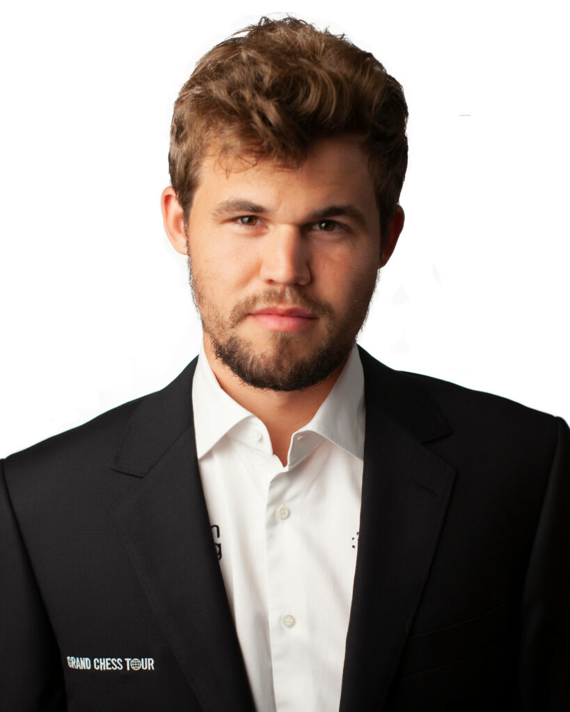 Magnus Carlsen Wallpaper: Confident Grand Chess Tour Formal Suit Background