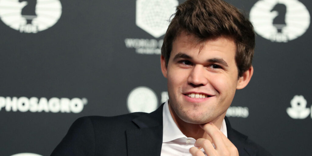 Magnus Carlsen Wallpaper: Confident Chess Grandmaster Background