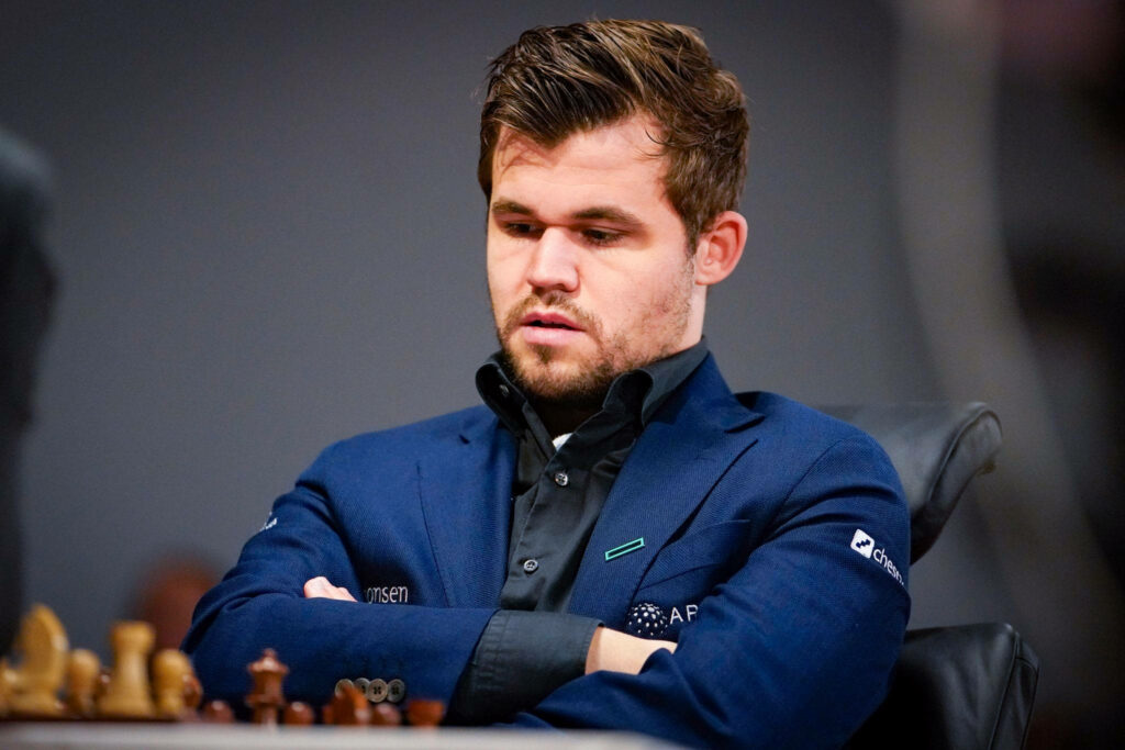 Magnus Carlsen Wallpaper: Focused Champion in Competitive Chess