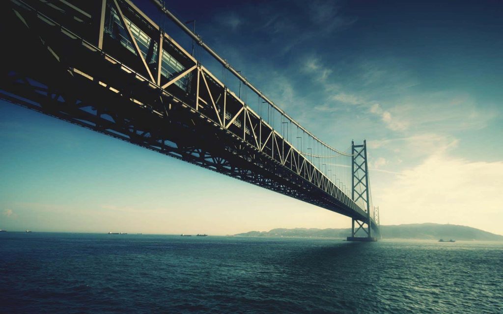 Akashi Kaikyo Bridge over calm waters at sunset dramatic low angle high resolution wallpaper