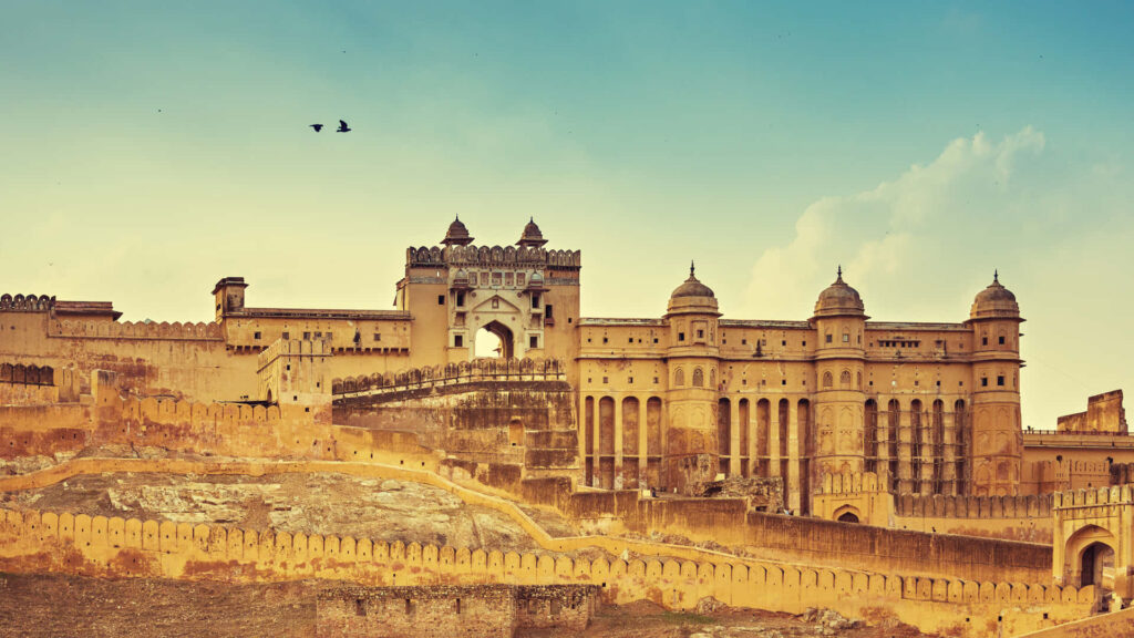 Majestic Amer Fort with grand architecture under serene sky historic Amber Fort wallpaper background