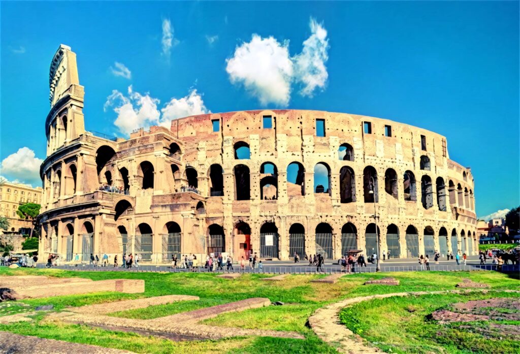 Colosseum at sunset with golden light and blue sky clouds historic Rome landmark wallpaper