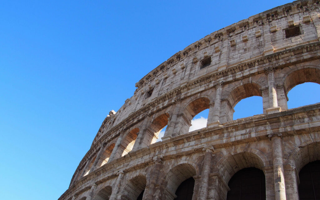 High-resolution Colosseum wallpaper showcasing ancient Roman arches and weathered stone textures