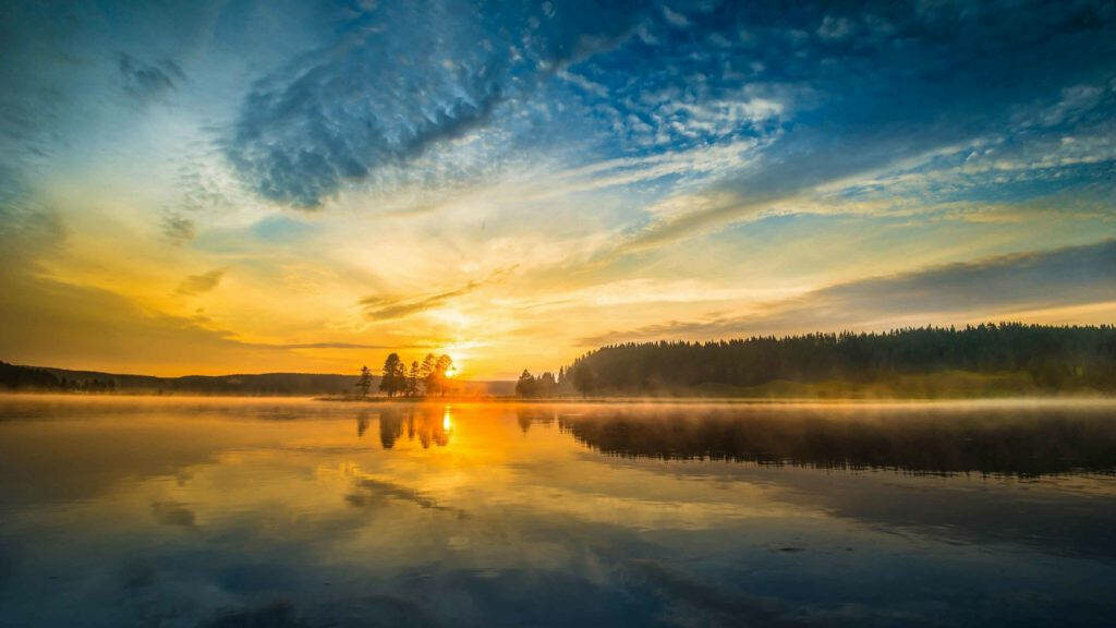 Rays of Morning Light Illuminate Majestic Lake Landscape Wallpaper