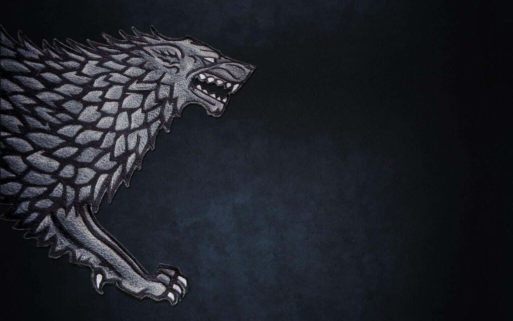 Majestic Dire Wolf Wallpaper: Heraldic Emblem on Dark Background