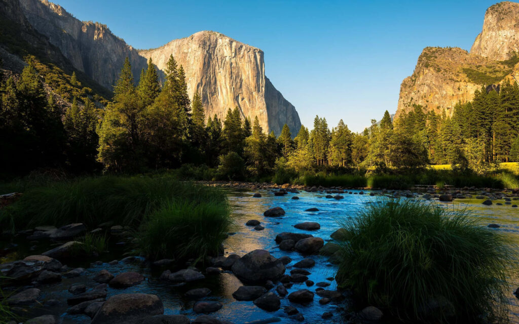 Serenity Embodied: Majestic Granite Monolith and Tranquil Lake at El Capitan Wallpaper
