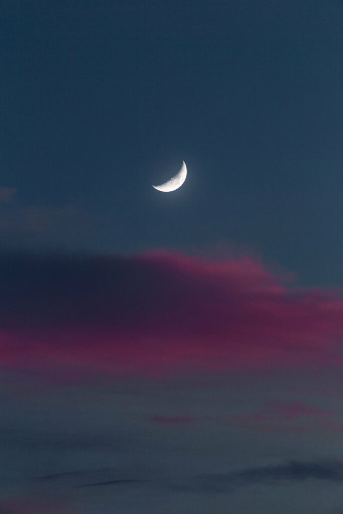 Majestic Evening: Captivating Full Moon Setting over a Vibrant Sunset Sky - HD Phone Wallpaper