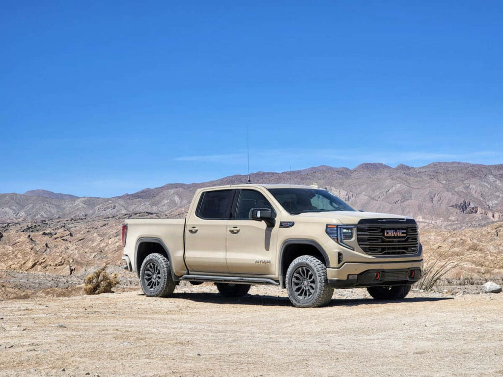 Majestic GMC Sierra Wallpaper: Scenic Desert Road & Clear Sky
