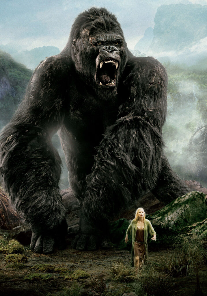 King Kong roaring atop skyscraper powerful cityscape dramatic wallpaper background scene