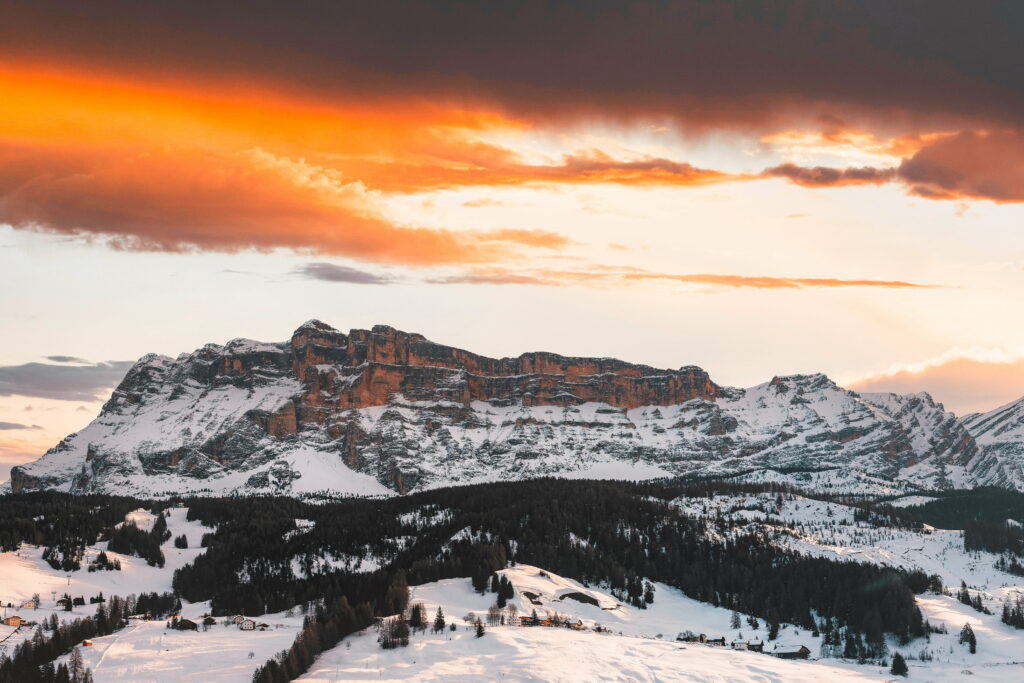 Majestic Snow-Covered Rocks: A Breathtaking HD Wallpaper of Clouds Embracing the Serene Nature Landscape