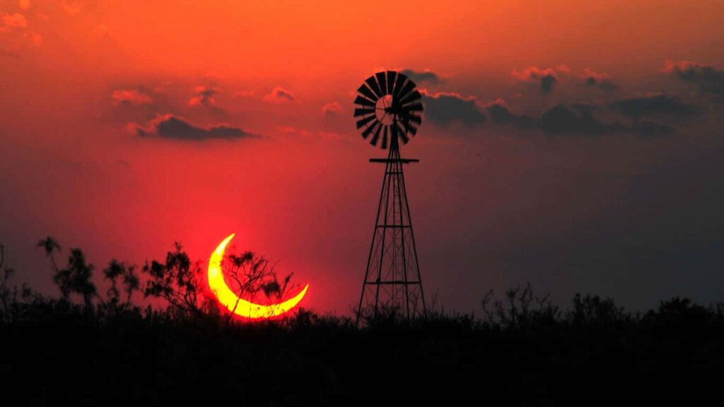 Majestic Sunset: Embracing the Tranquil Beauty of a Rural Windscape Wallpaper