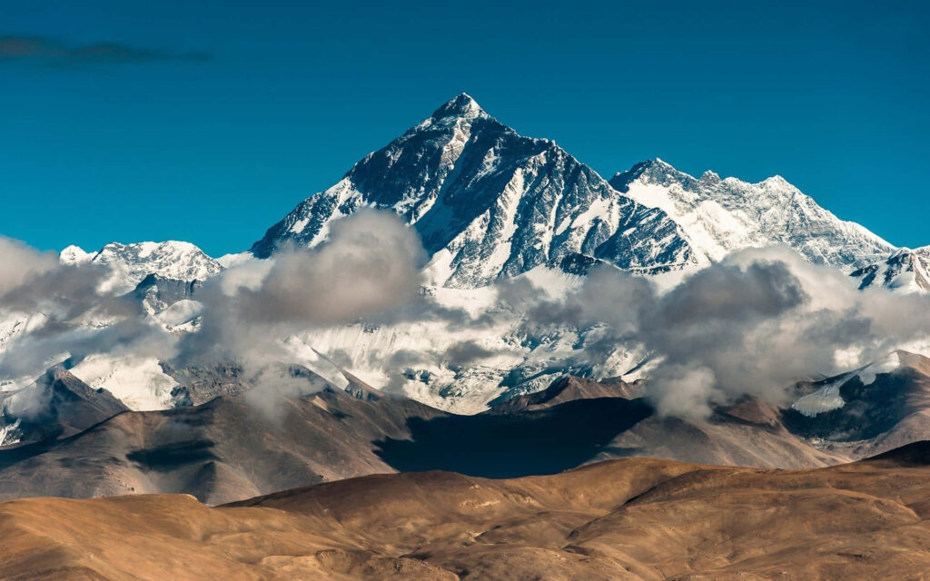 Stunning Mount Everest Wallpaper: Majestic Peaks & Blue Sky Background