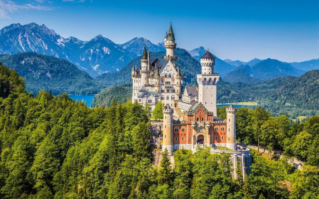 The Enchanting Neuschwanstein: Magnificent Romantic Castle Amidst Stunning German Mountain Landscape Wallpaper