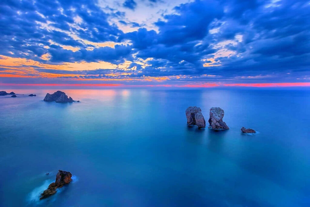 Majestic Rock Formations at Sunset - Serene Desktop Wallpaper
