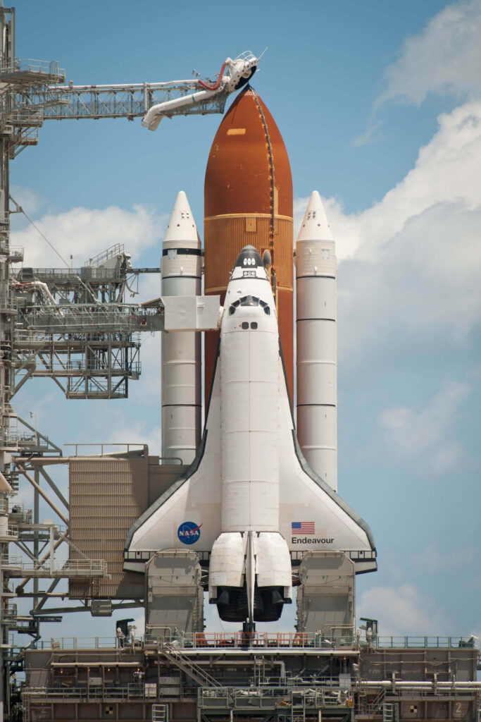 Stunning Space Shuttle Endeavour Launch Pad Wallpaper Against Blue Sky