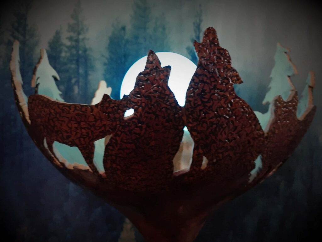 Majestic Wolf Silhouette Howling Under Moonlight - Serene Forest Background Wallpaper