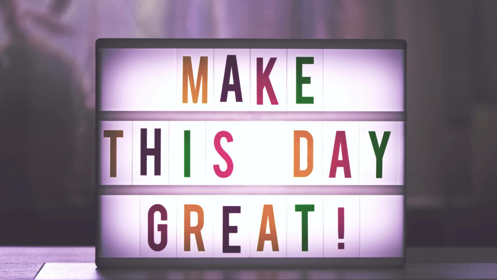 Empowering Your Day with a Vibrant Inspirational Quote on a Cinema Light Box - A Captivating 4k Ultra HD Wallpaper for Motivation