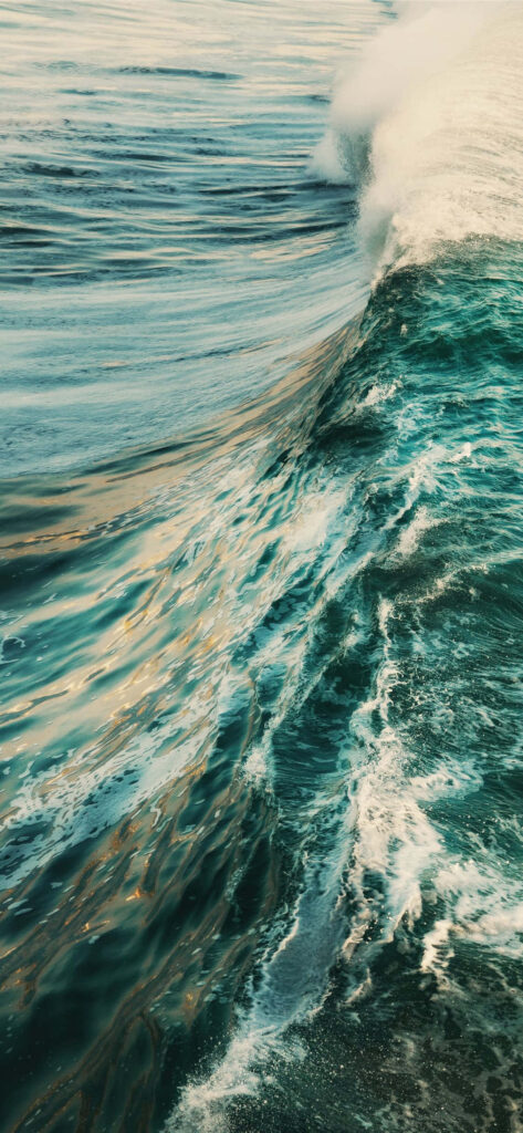 Serene Scenery: Captivating Malibu Shoreline Embraced by Vibrant Daytime Ocean Waves Wallpaper