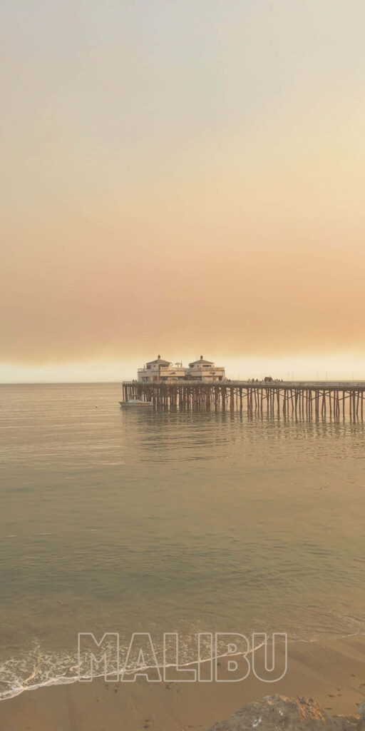 Majestic Malibu: Capturing the Awe-Inspiring Beauty of Farm Pier Café against a Stunning Coastal Backdrop Wallpaper