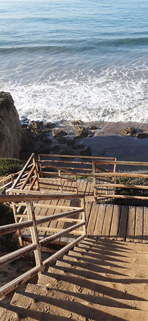 Stunning Coastal Landscape Highlighting a Stylish Staircase by Malibu Beach Wallpaper