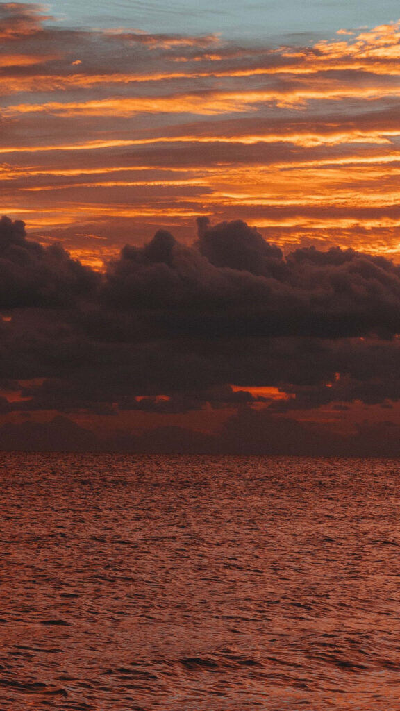 Dramatic Sunset Over Peaceful Malibu Coastal Scene Wallpaper