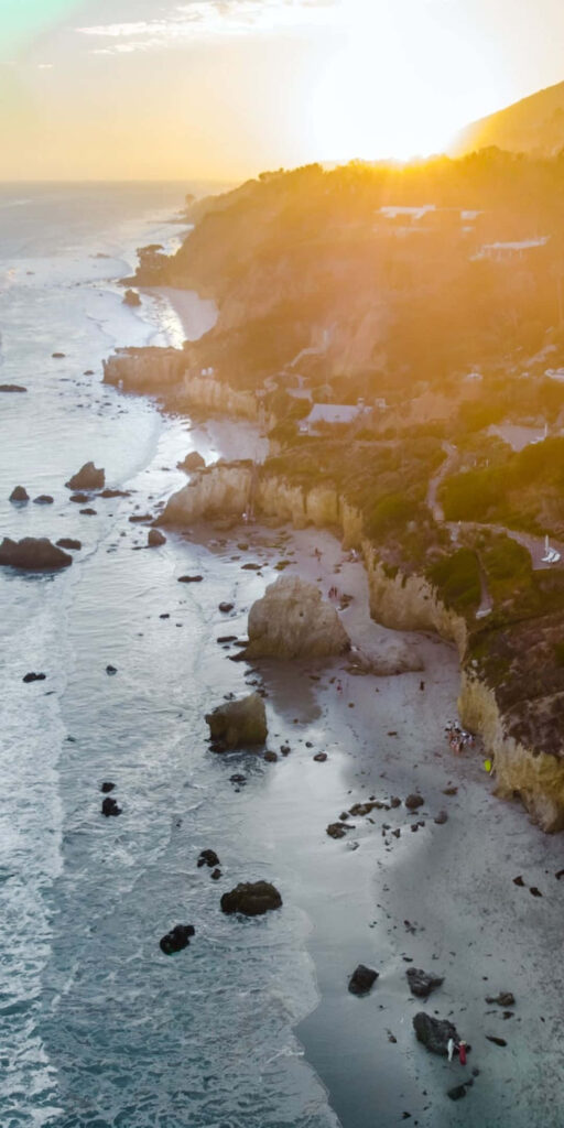 Nature's Beauty: Captivating Malibu Coastline adorned with Majestic Rocky Terrain Wallpaper