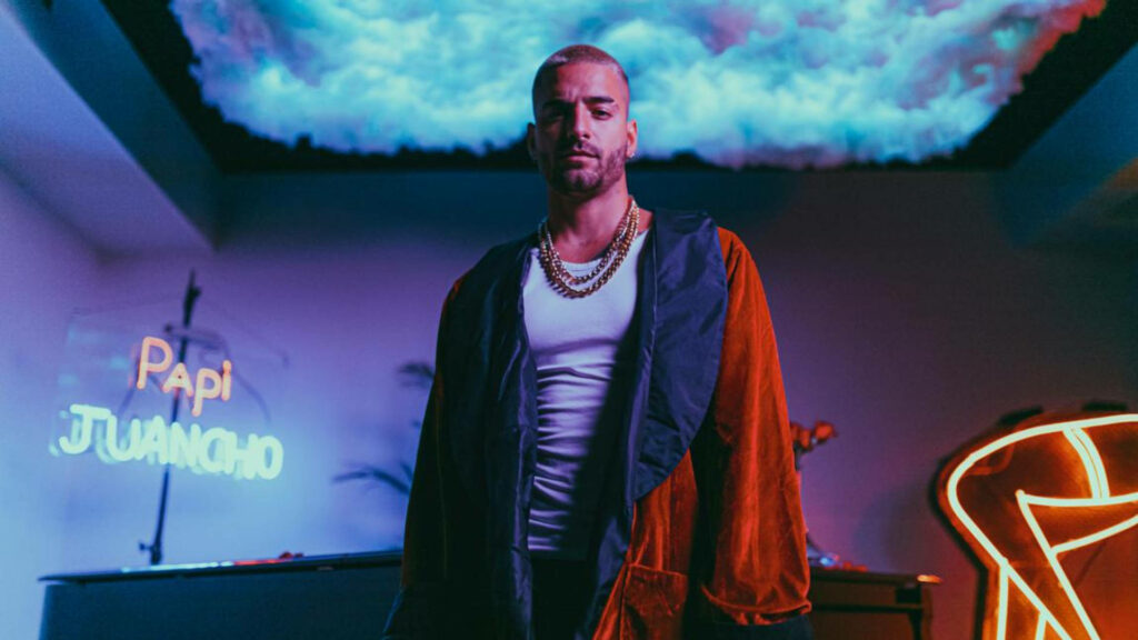 Maluma confident under vibrant lights showcasing bold dynamic style Papi Juancho wallpaper background