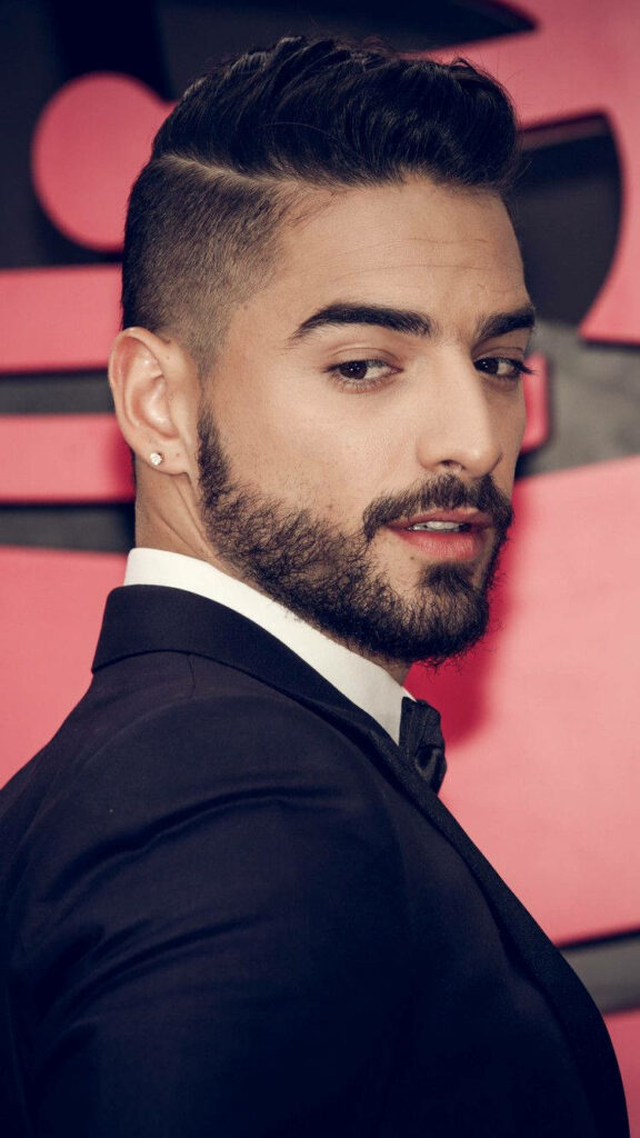 Maluma stylish and confident in sharp suit rapper and singer wallpaper background photo