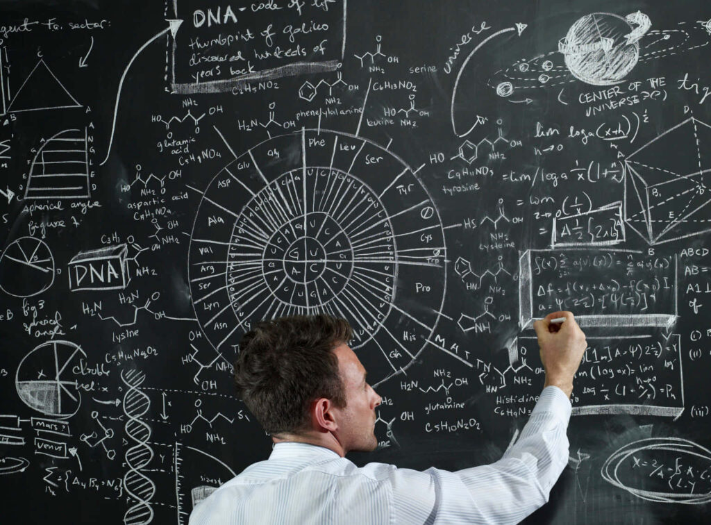 Man writing scientific formulas on chalkboard with DNA, planets, and math equations wallpaper background