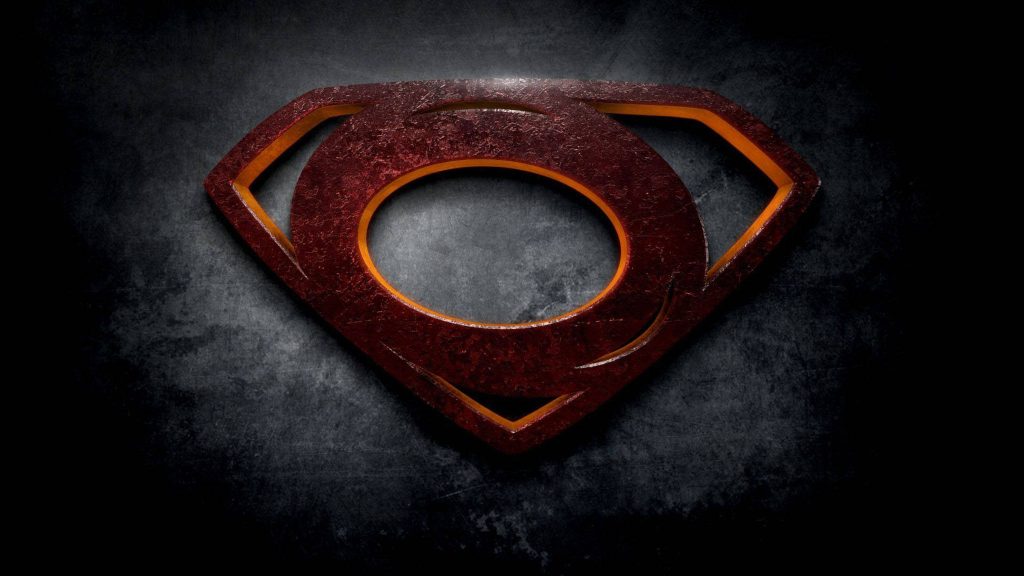 Rusty metallic O shaped like Superman crest with glowing orange edges on dark textured background Wallpaper