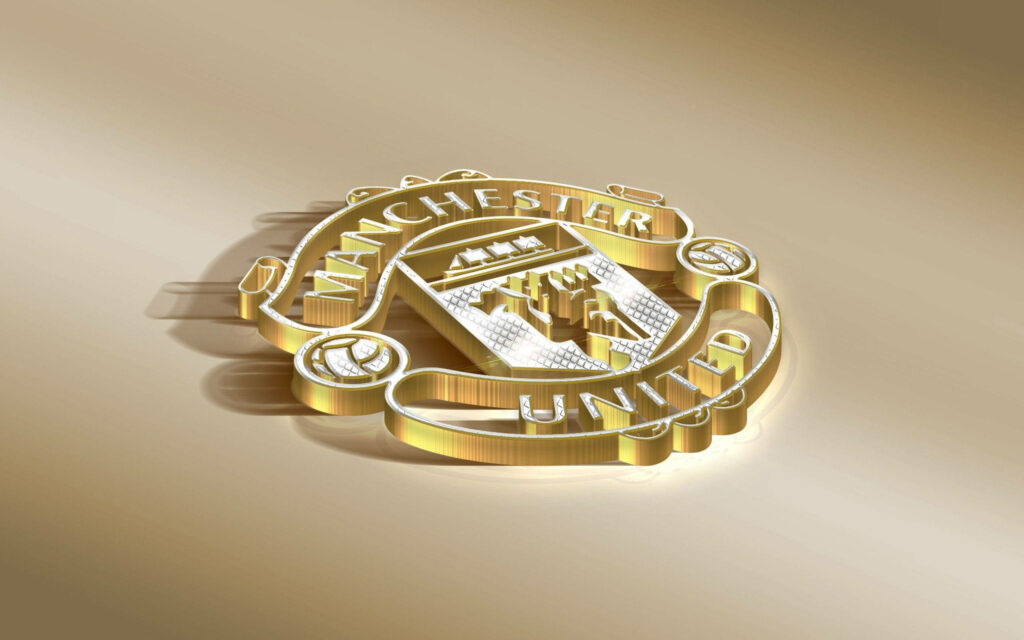 Manchester United Red Devil logo in gold on sleek modern background high resolution wallpaper