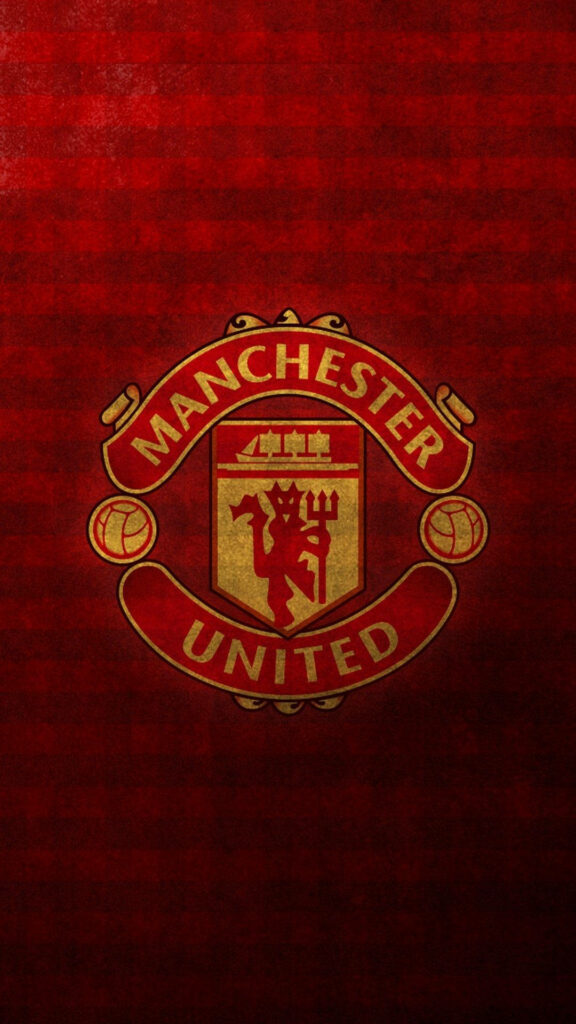 Manchester United logo on rich red textured background showcasing club pride and tradition Wallpaper