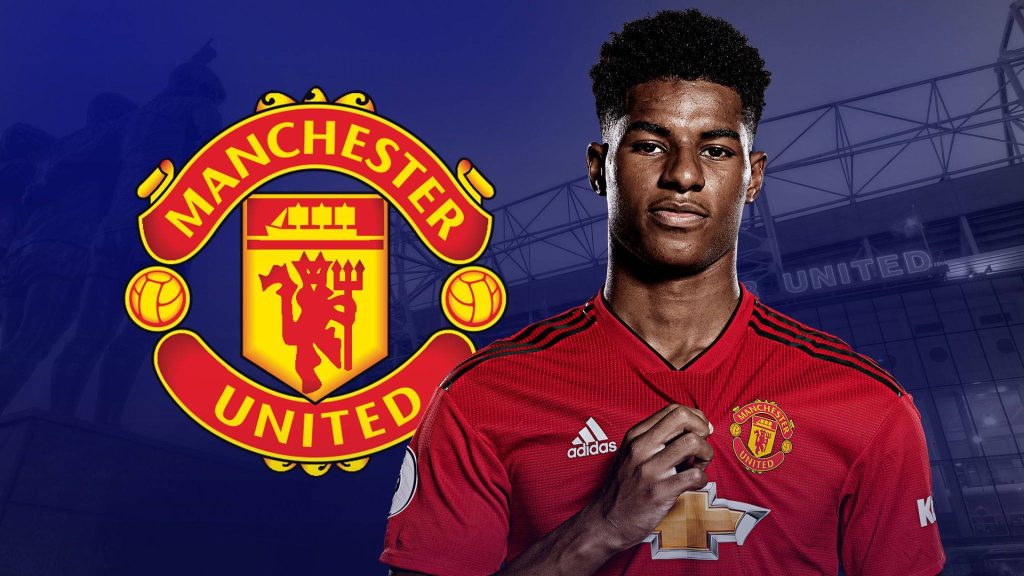 Manchester United wallpaper with Marcus Rashford in red kit Old Trafford stadium and club crest