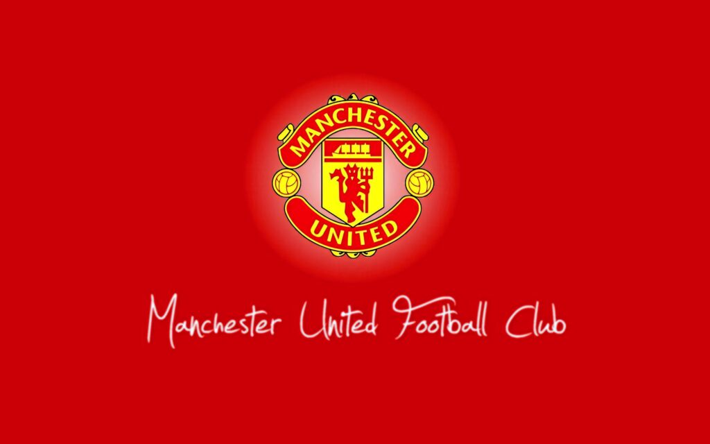 Manchester United team crest on vibrant red background wallpaper showing football club pride