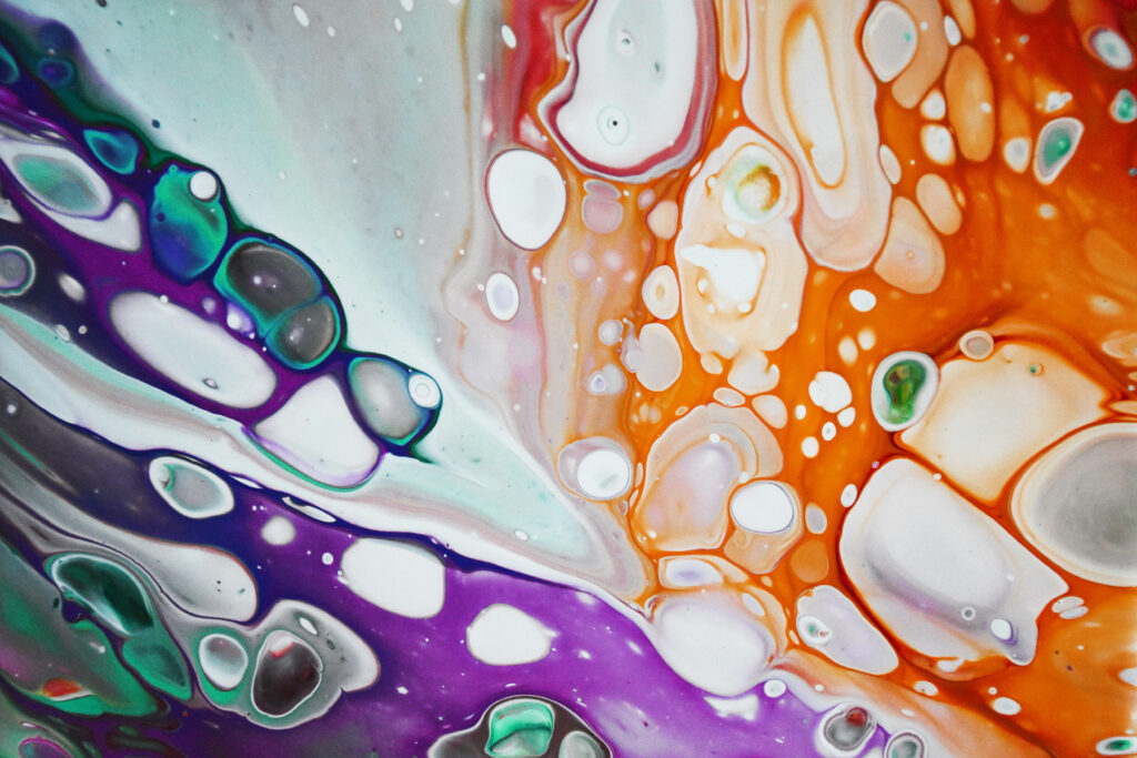 Abstract acrylic pour wallpaper with vibrant violet and orange swirling marble cell patterns