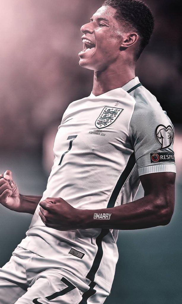 Marcus Rashford England striker goal celebration wallpaper white kit dramatic lighting background